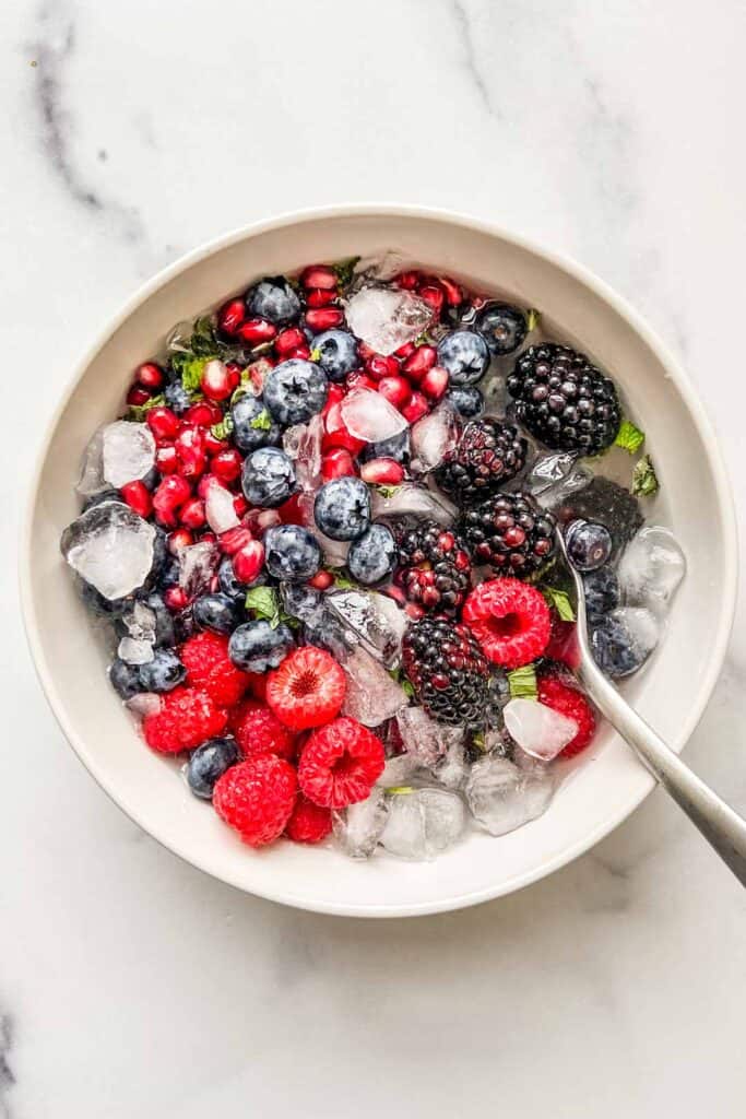 A bowl of nature's cereal with a silver spoon.