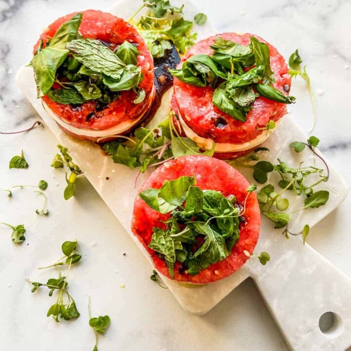 An overhead shot of three stacks of watermelon mozzarella salad.