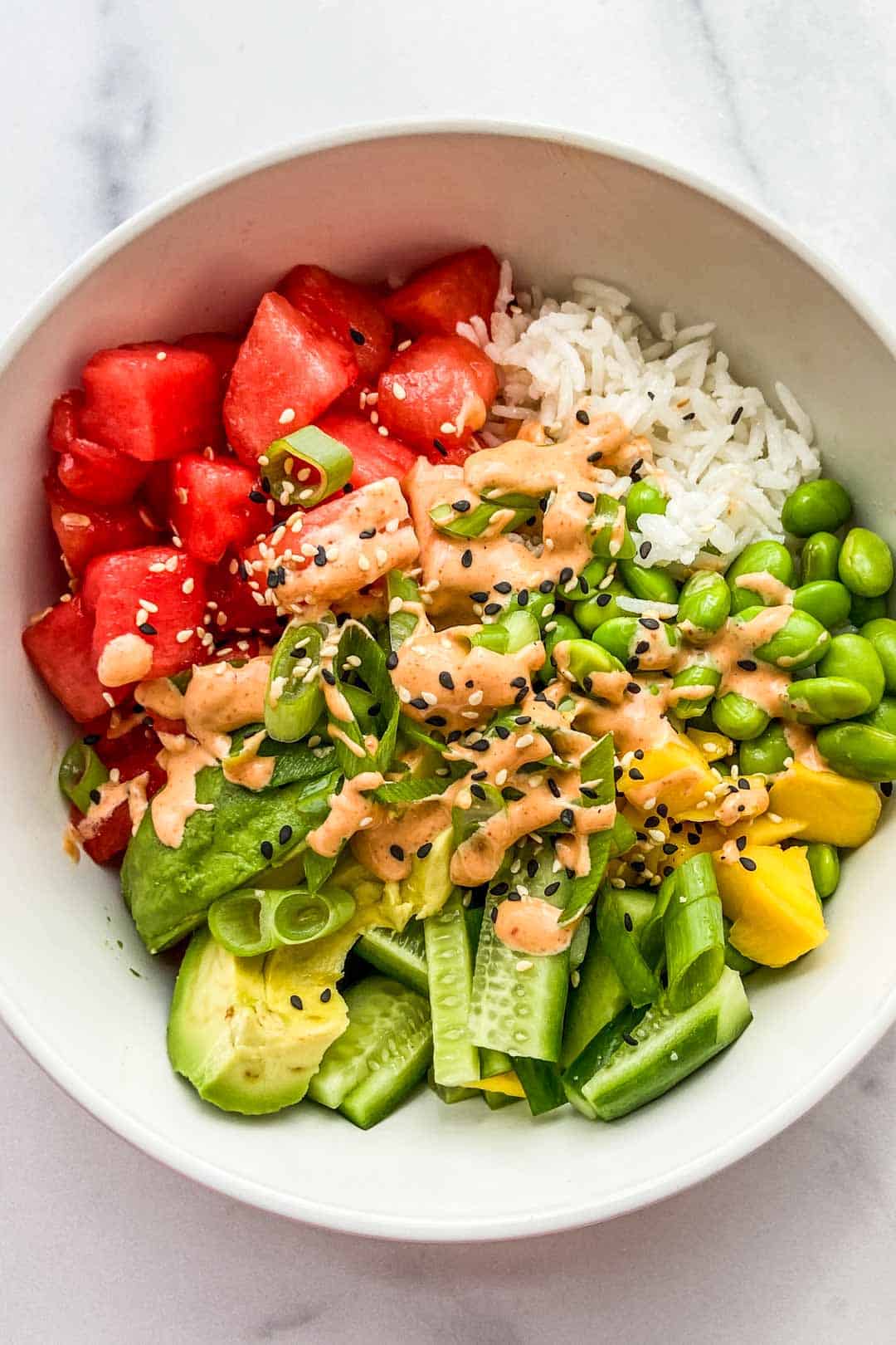 A closeup shot of a bowl of watermelon poke.