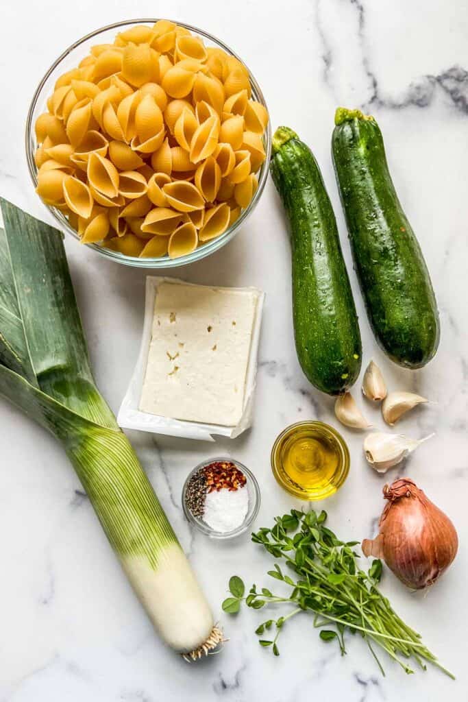 Ingredients for feta, leek, zucchini, and shallot pasta. 