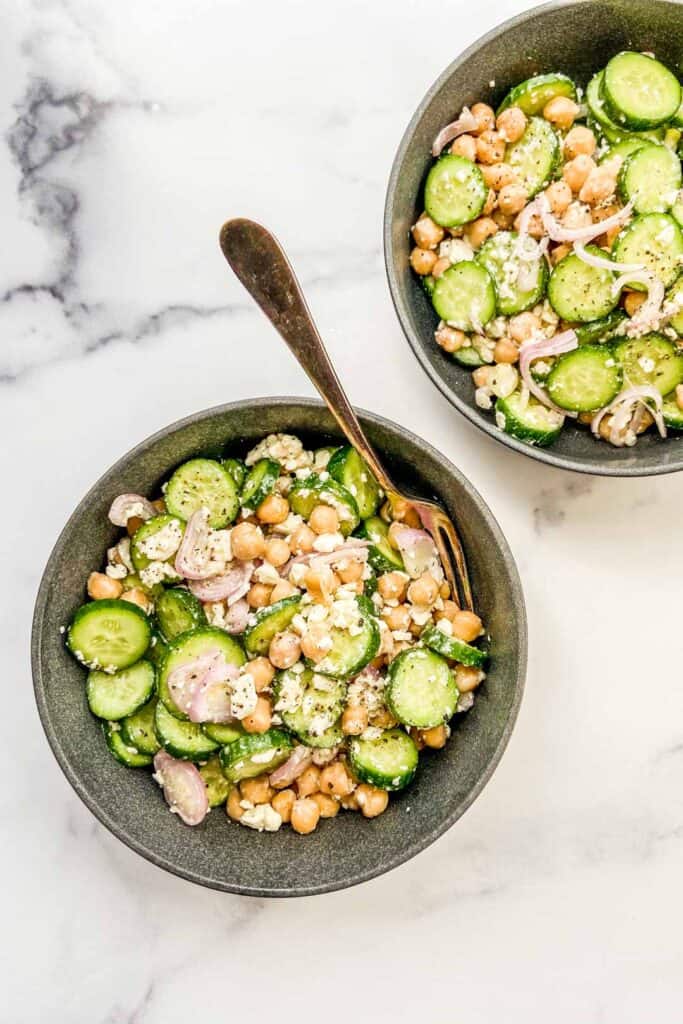 Two bowls with chickpea salad.