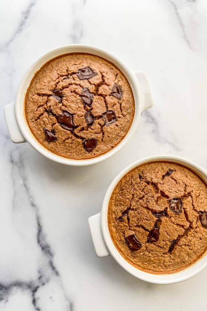 Two ramekins of chocolate baked oats.