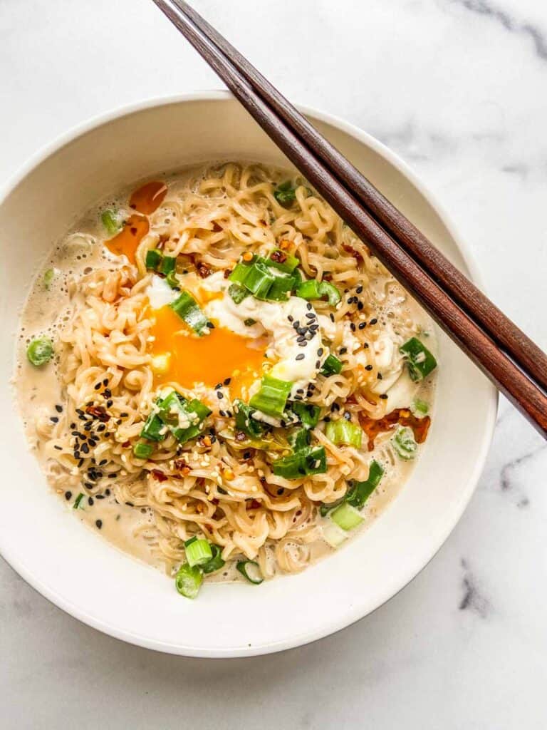 A bowl of milk ramen with a poached egg.