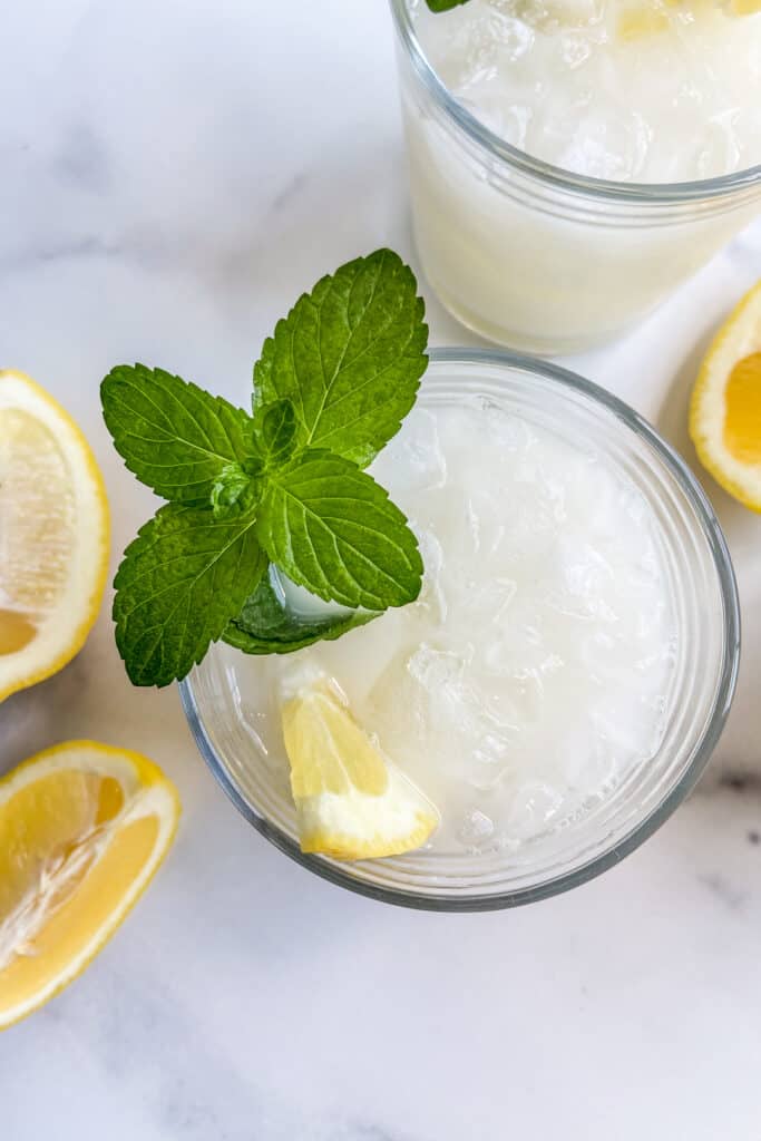 A closeup of a glass of creamy lemonade.