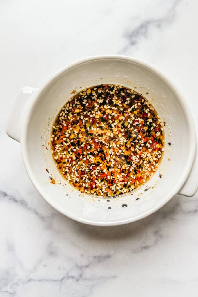 A sesame dressing in a ramekin.