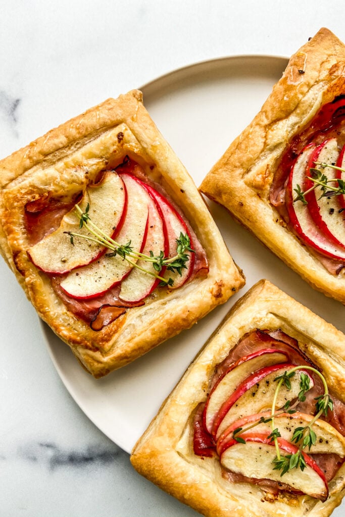 A closeup of ham and gruyere tarts.