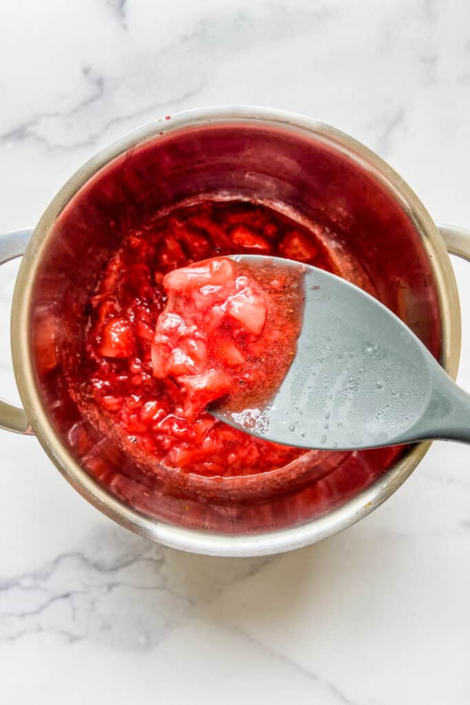 Strawberry Syrup in a small pot.