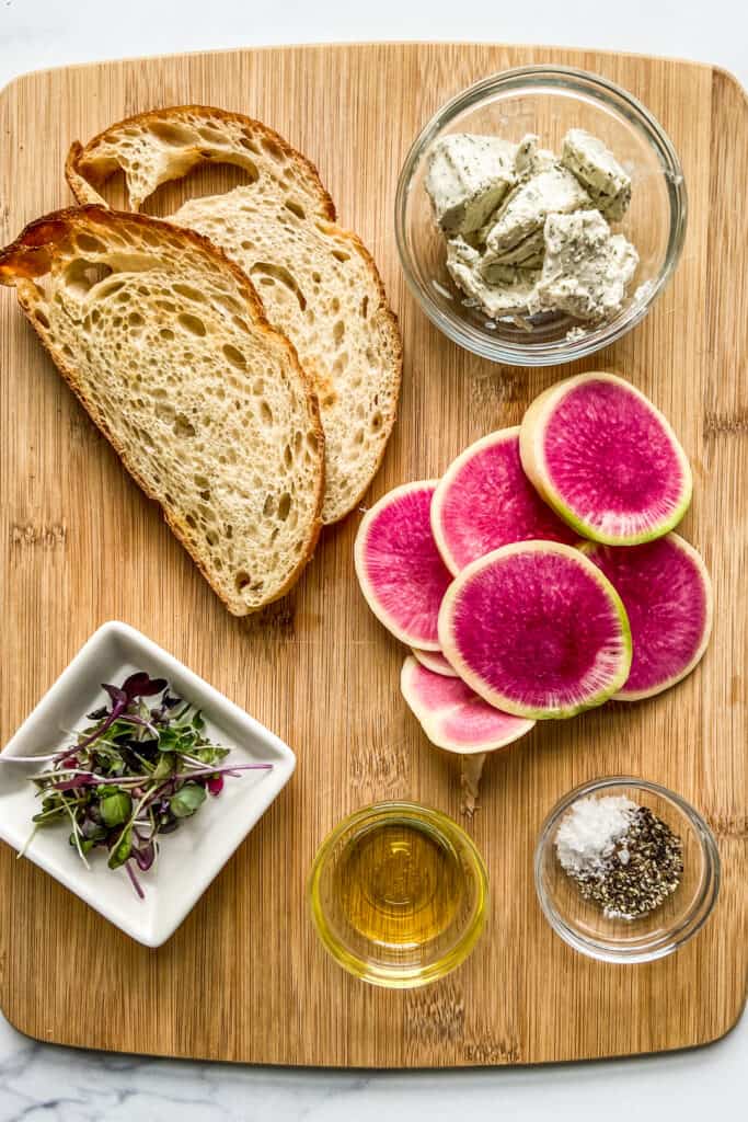 Ingredients for radish toast on a cutting board.