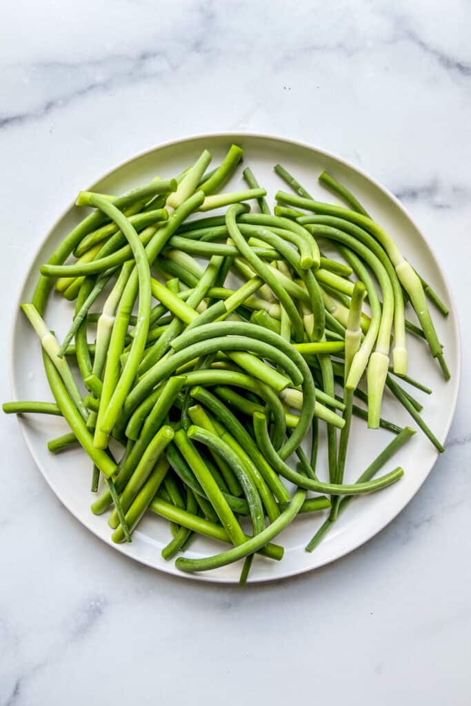 A plate of chopped garlic scapes.