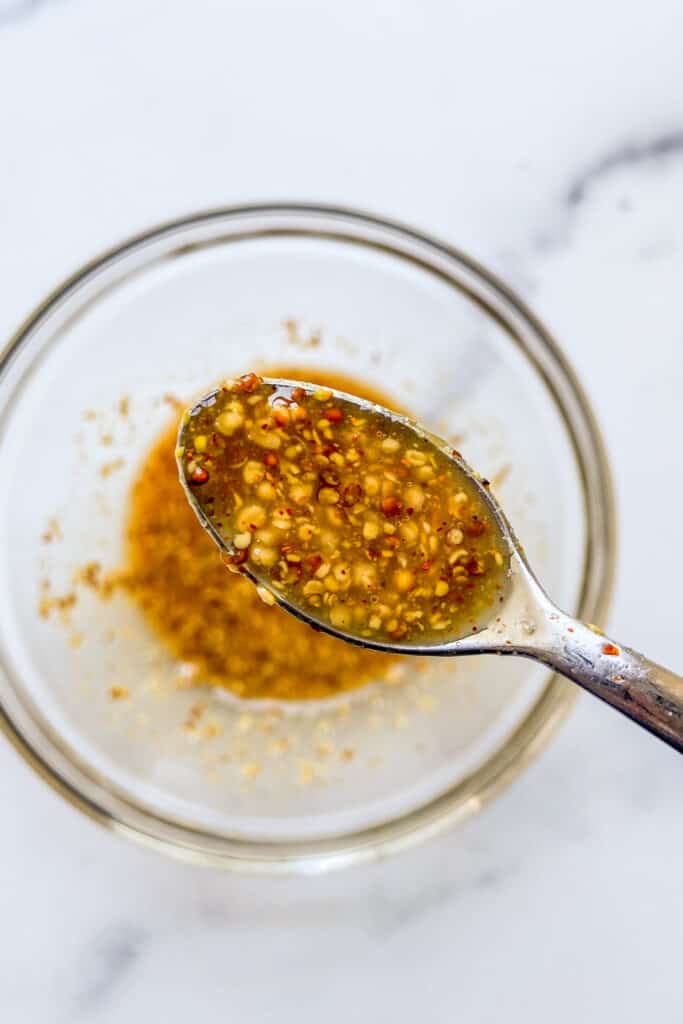 A closeup shot of a bowl of mustard sauce.