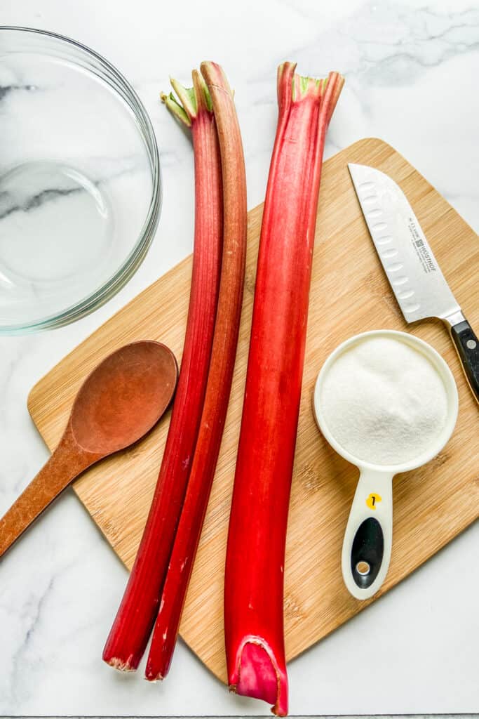 ingredients for a rhubarb shrub on a cutting board.