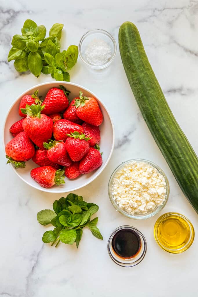 Strawberry cucumber salad ingredients.