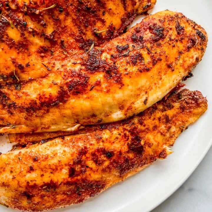 A closeup shot of cooked tilapia fillets.