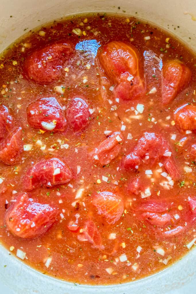 A closeup of marinara sauce cooking.