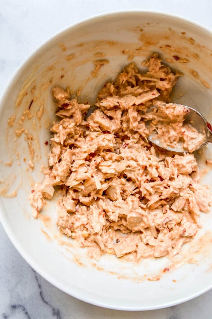 Spicy tuna mixture in a white bowl.
