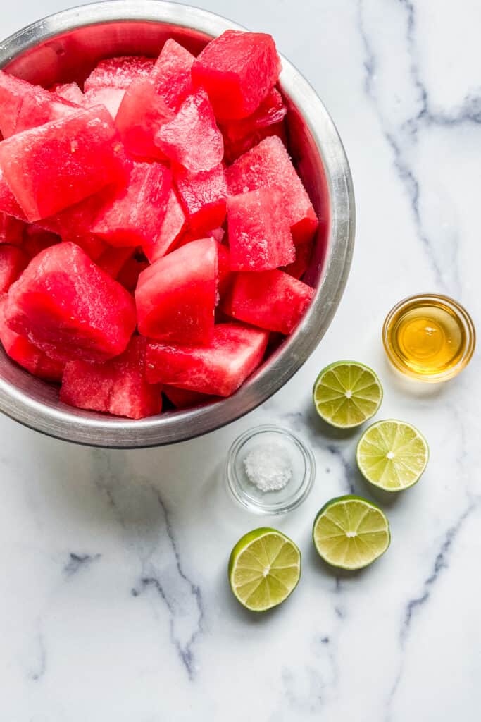 Frozen watermelon chunks, two halved limes, honey, and sea salt. 