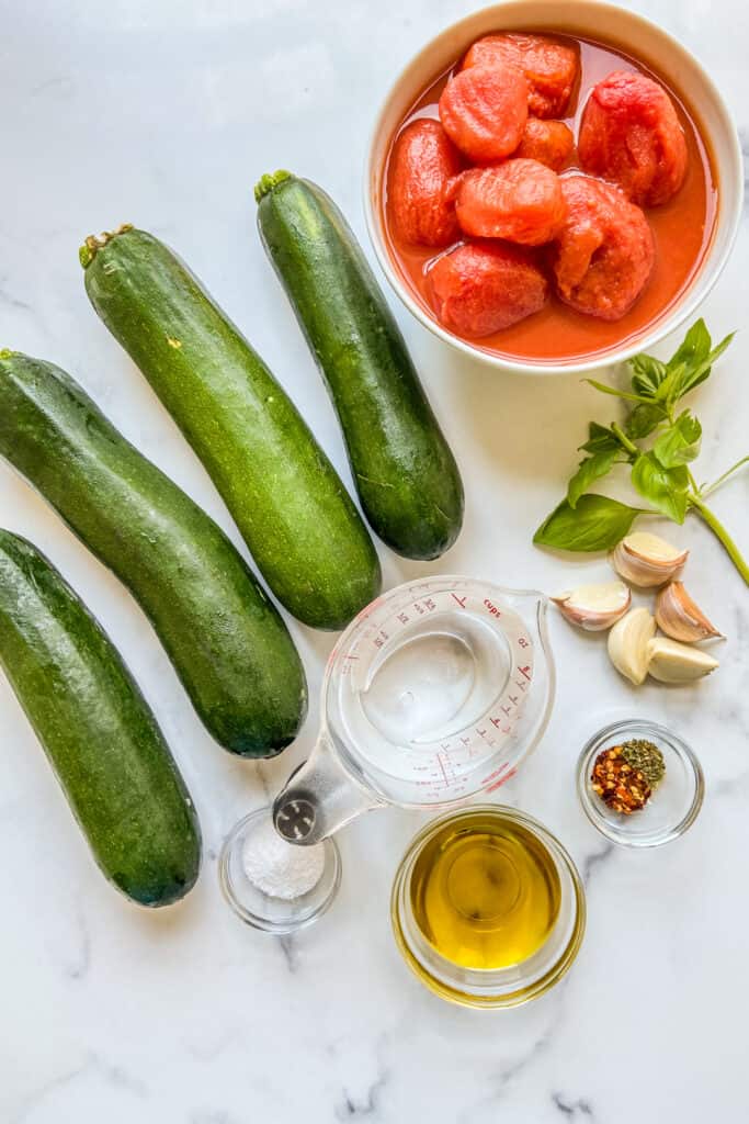 Ingredients for zucchini noodles and tomato sauce.