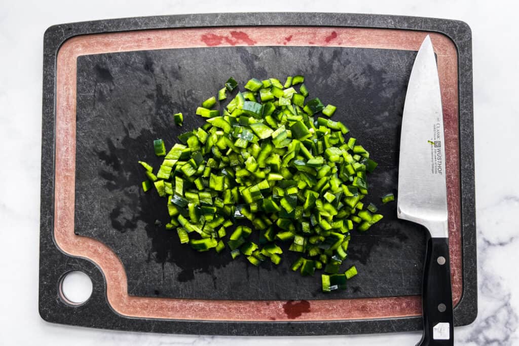 Chopped poblano pepper on a cutting board.