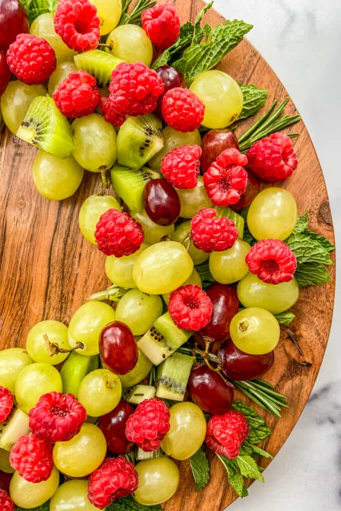 A closeup shot of a holiday fruit wreath.