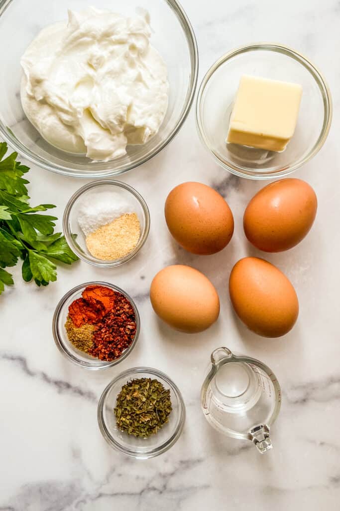 Yogurt, eggs, butter, spices, Aleppo chili flakes, parsley, and vinegar.