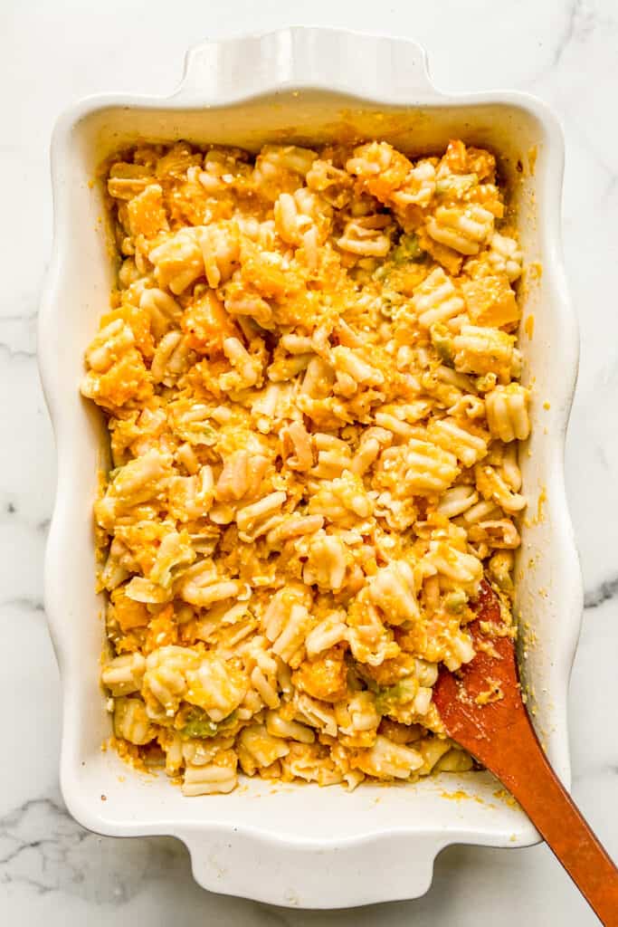 An overhead shot of a baking dish with butternut squash feta pasta.