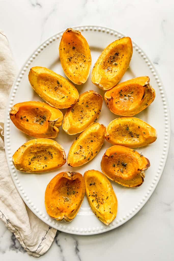 A large platter with carnival delicata squash.