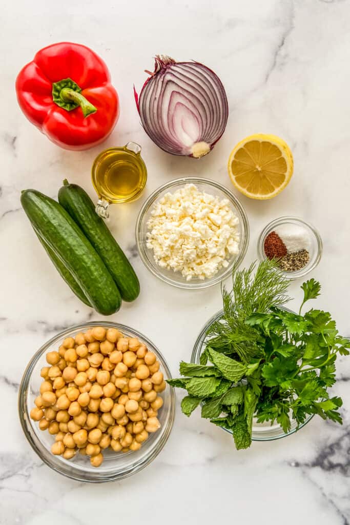 Bell pepper, red onion, olive oil, feta cheese, lemon, cucumbers, spices, fresh herbs, and chickpeas.