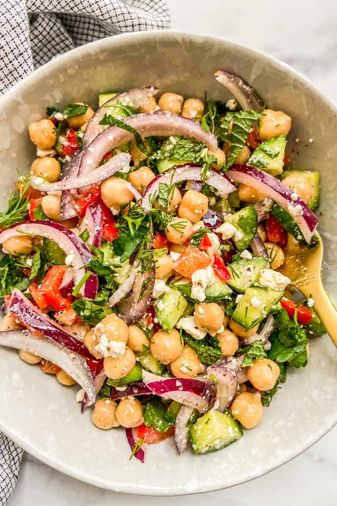 A bowl of Mediterranean chickpea salad.