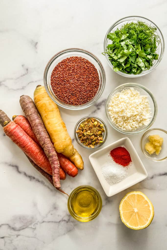 Rainbow carrots, red quinoa, herbs, feta, spices, garlic, pistachios, lemon, and olive oil.