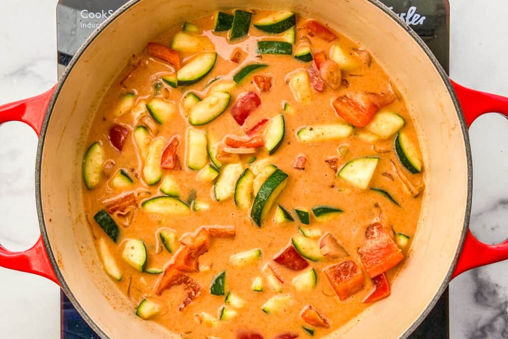 Coconut milk fish curry in a dutch oven.