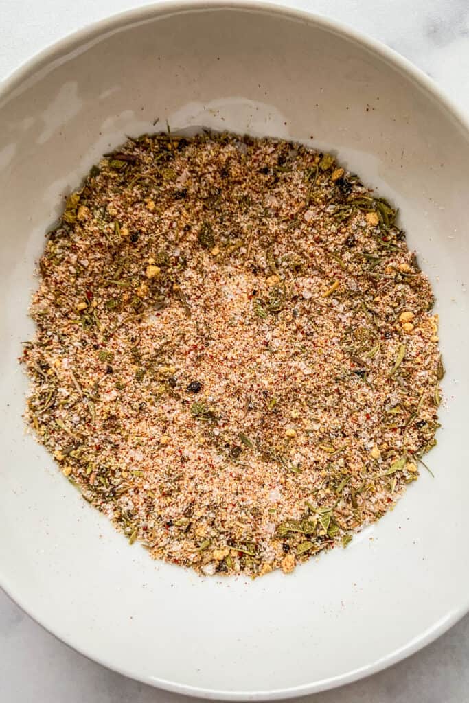 Chicken seasoning spice mix in a small bowl.