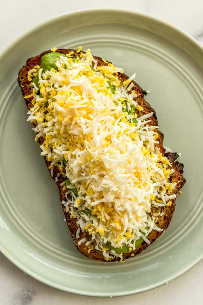Grated egg on a piece of avocado toast.