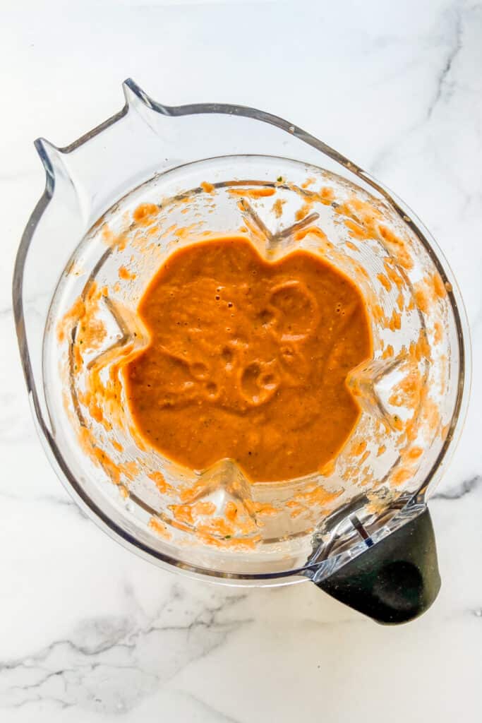 The tomato basil soup in a blender.