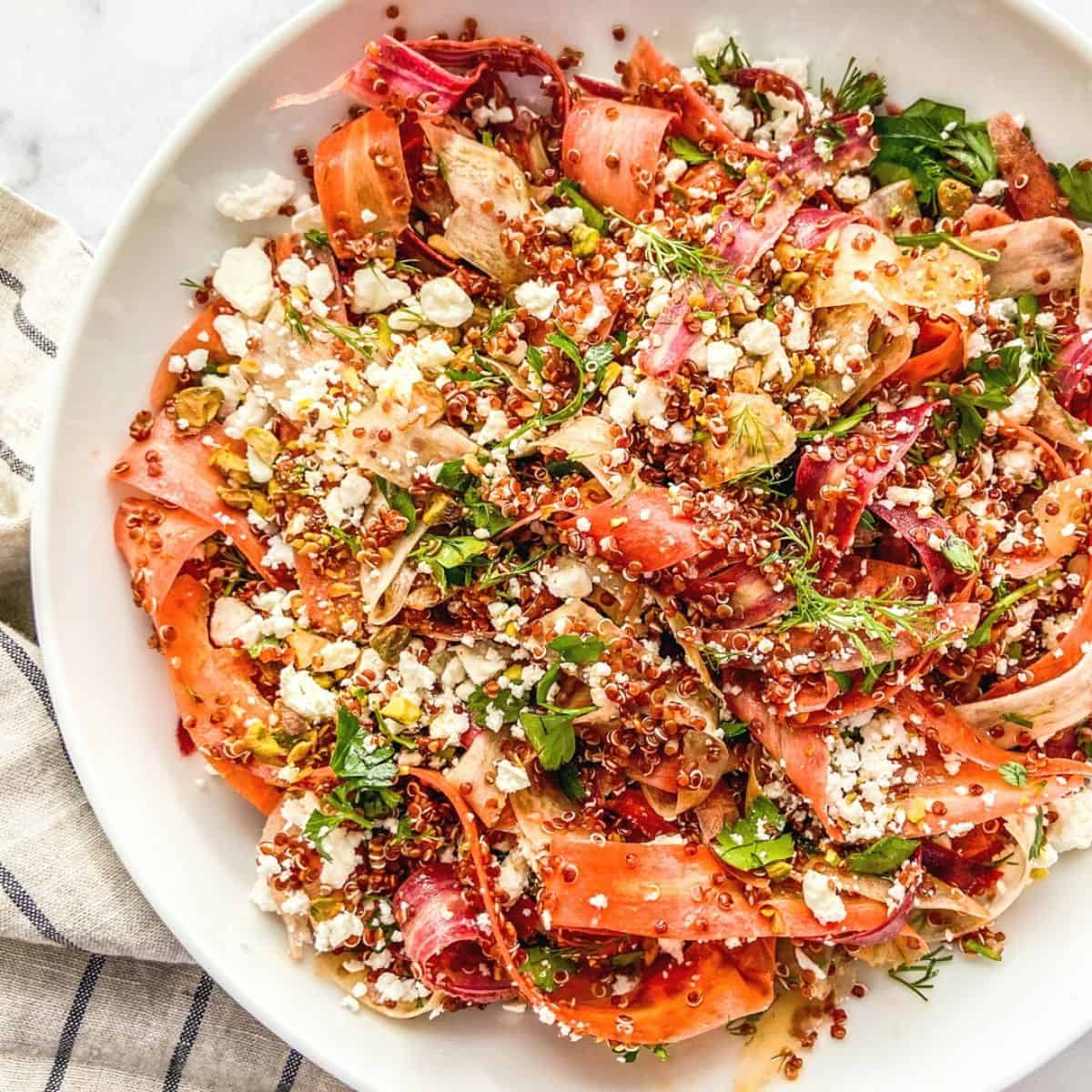 A healthy Easter side dish of shaved rainbow carrots and quinoa.