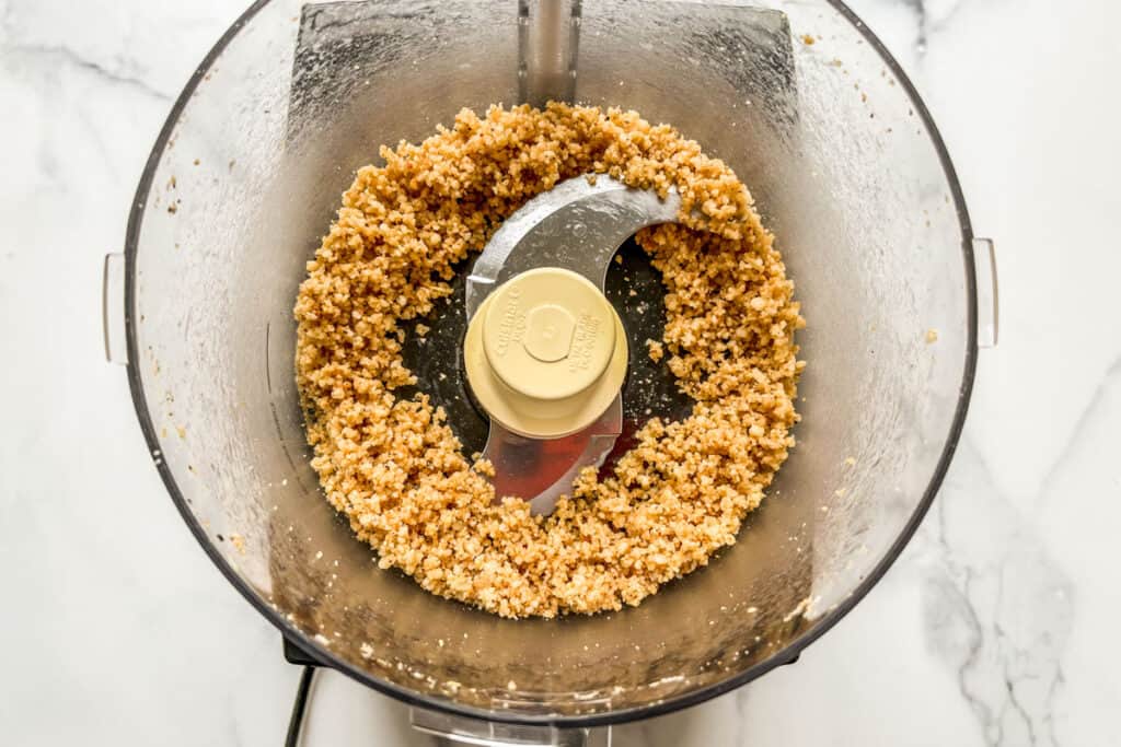Pulsed pine nuts and parmesan in a food processor.