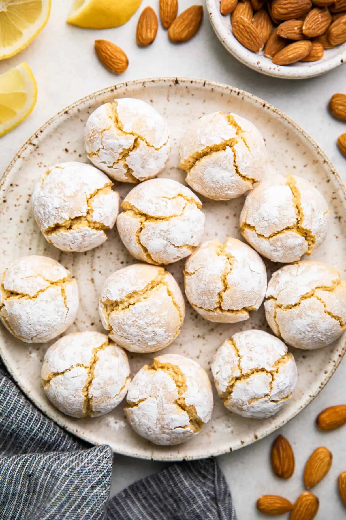 Amaretti cookies on a white plate.