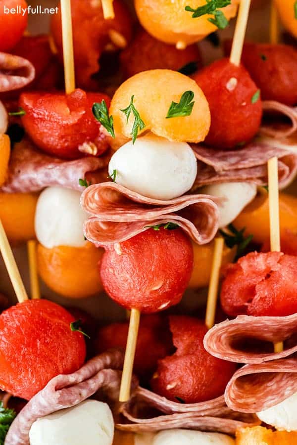 Fruit kabobs with watermelon and cantaloupe.