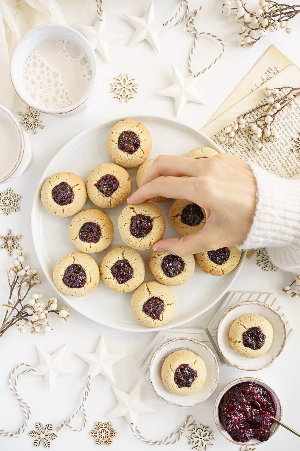 Almond flour thumbprint cookies on a plate.