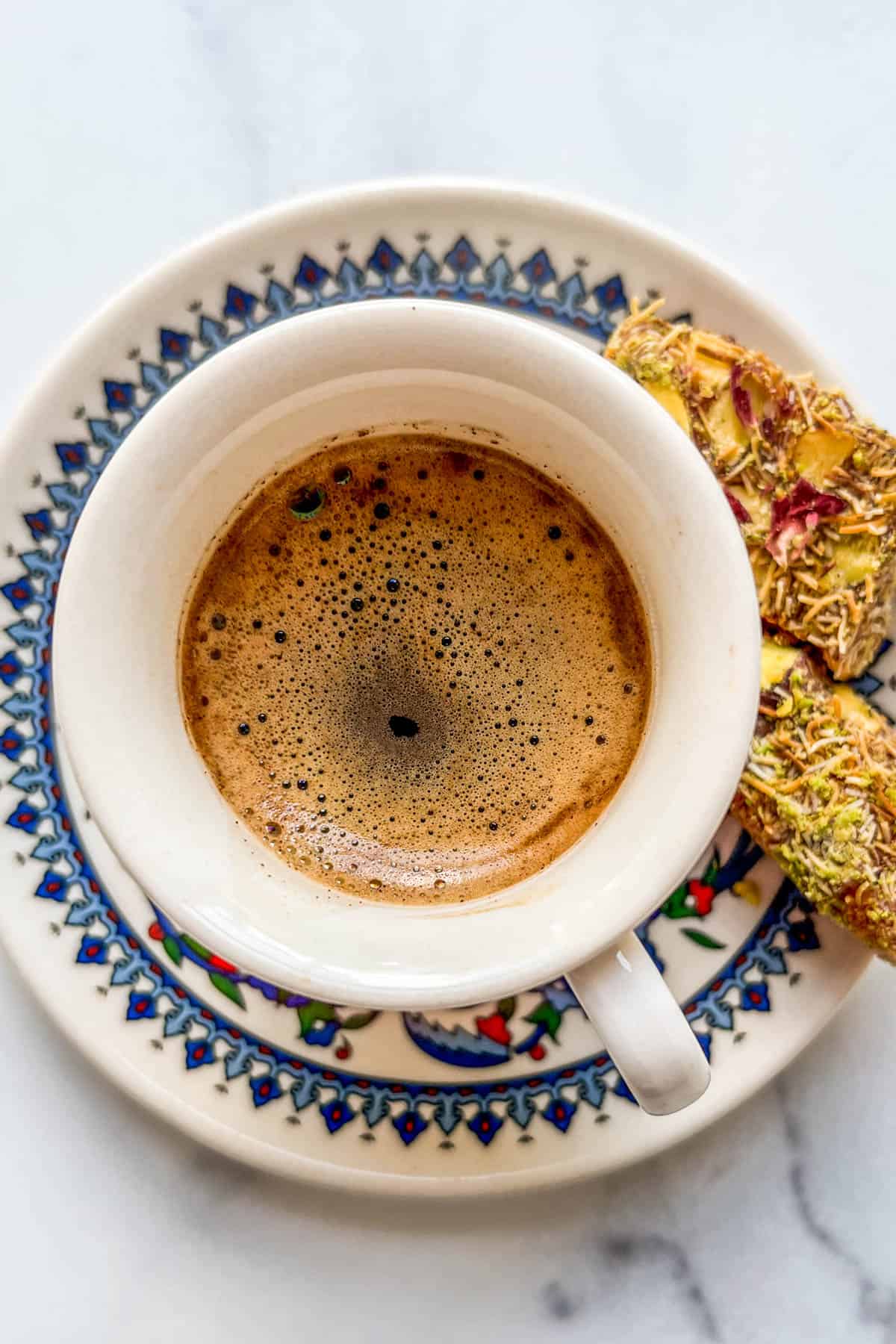 A closeup shot of a cup of Turkish coffee.