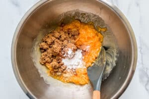 Sugar and spices being mixed into the cantaloupe bread dough.