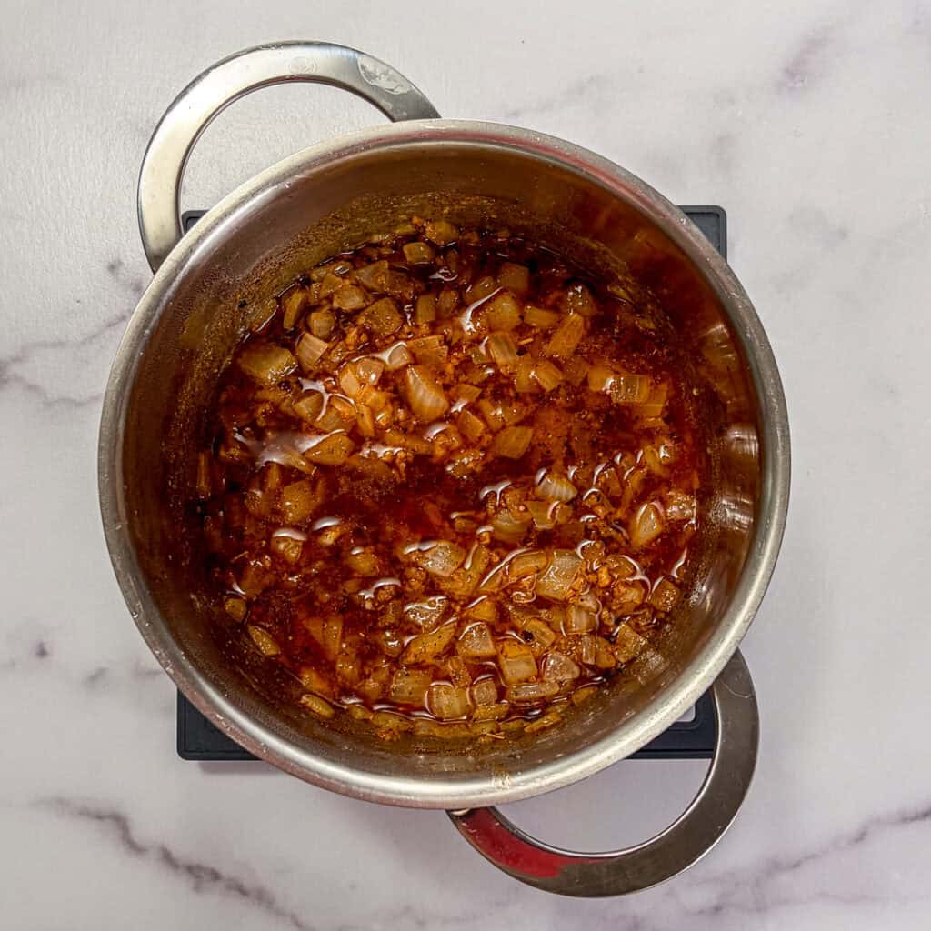 Spiced seafood butter sauce in a small sauce pan.