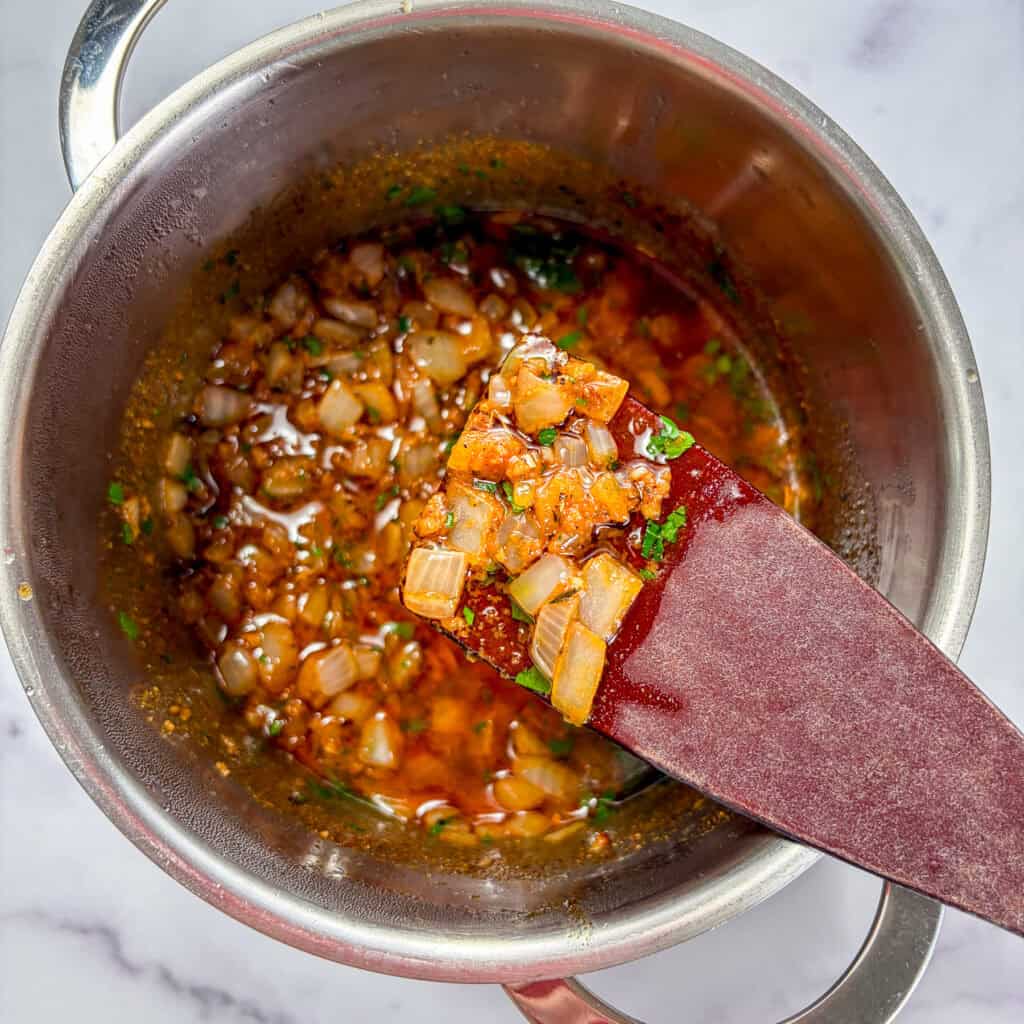 Shrimp boil sauce in a small sauce pan.