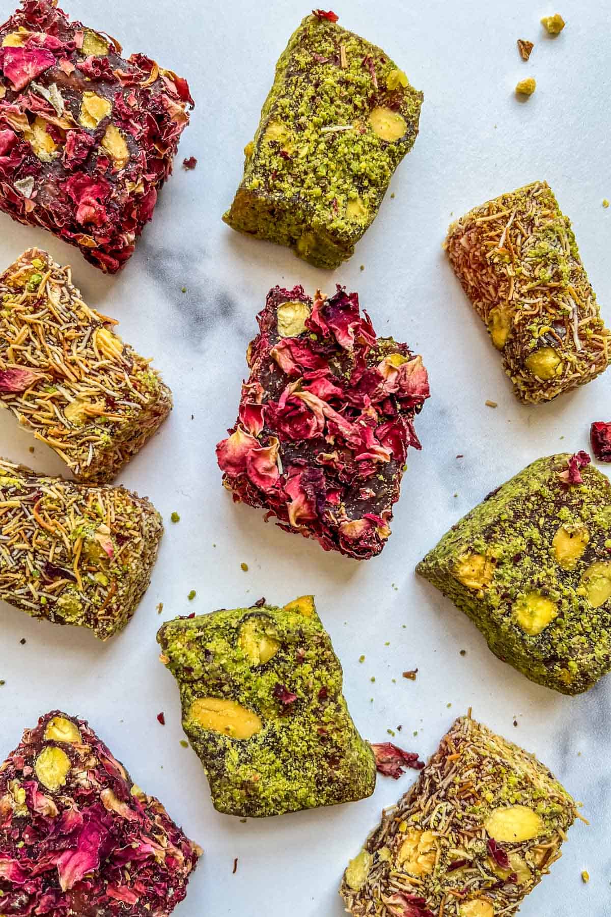 Three kinds of Turkish delight on a marble background.