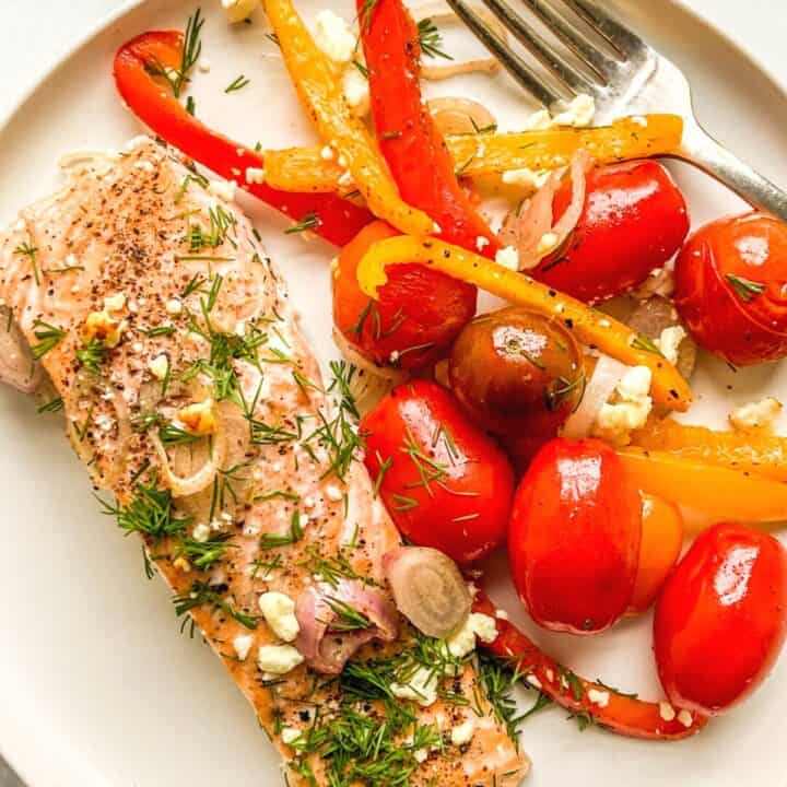 Healthy salmon recipes - a piece of salmon with tomatoes and peppers.