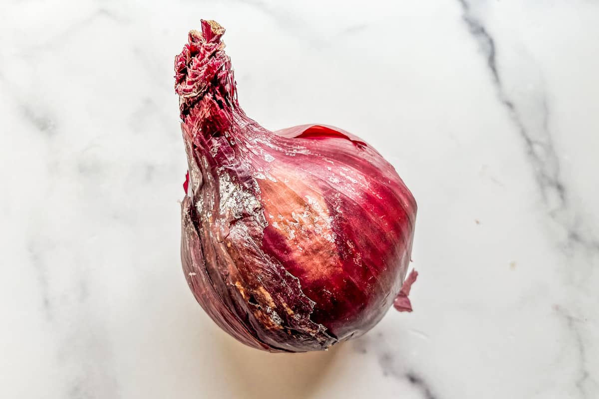 A red onion with mold.