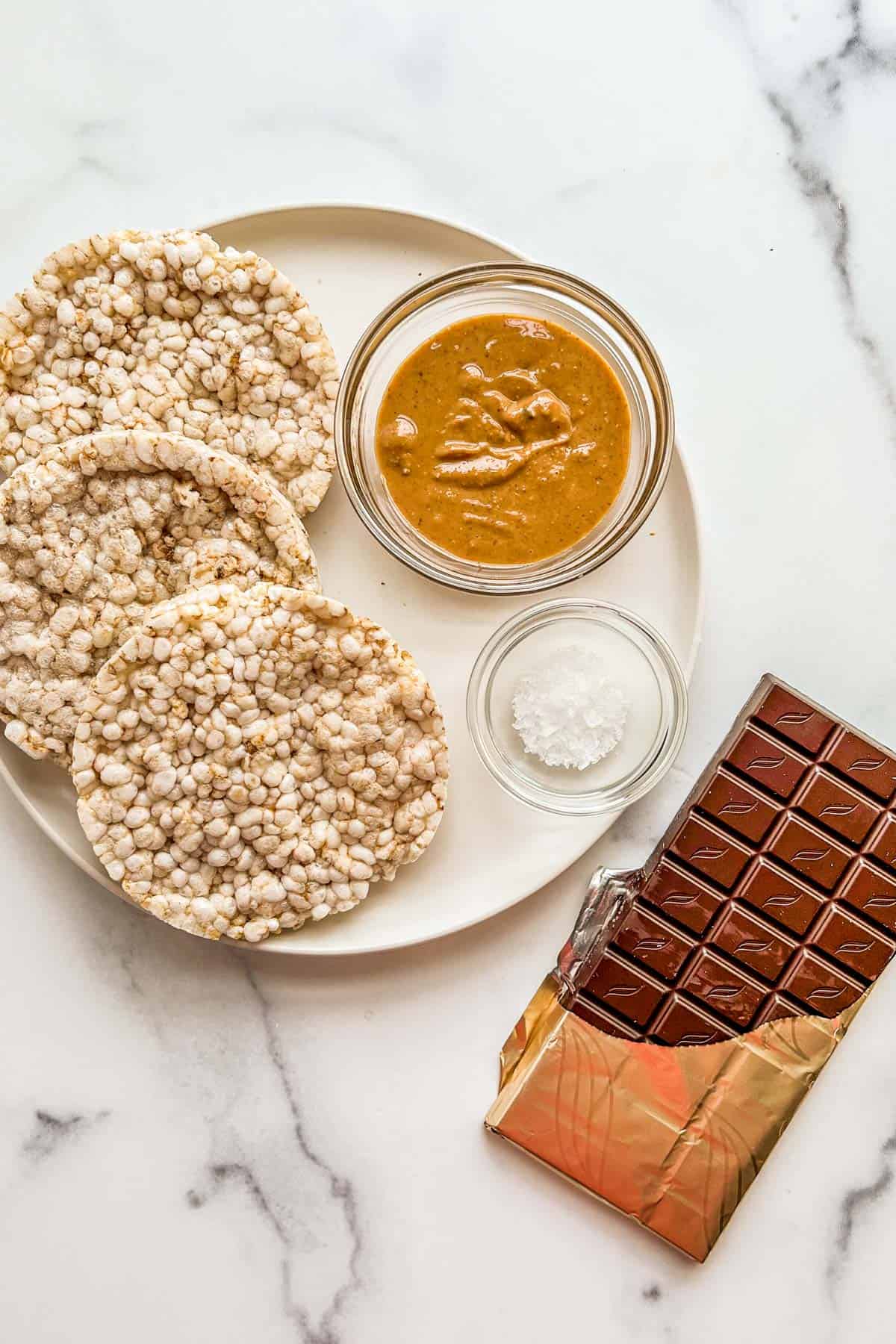 Rice cakes, peanut butter, flaky sea salt, and dark chocolate.