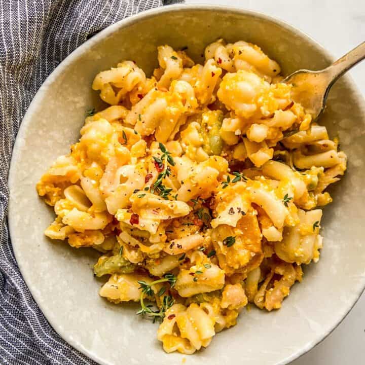 Butternut squash feta pasta in a bowl with a fork.