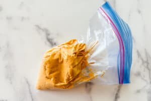 Pumpkin filling in a plastic bag.