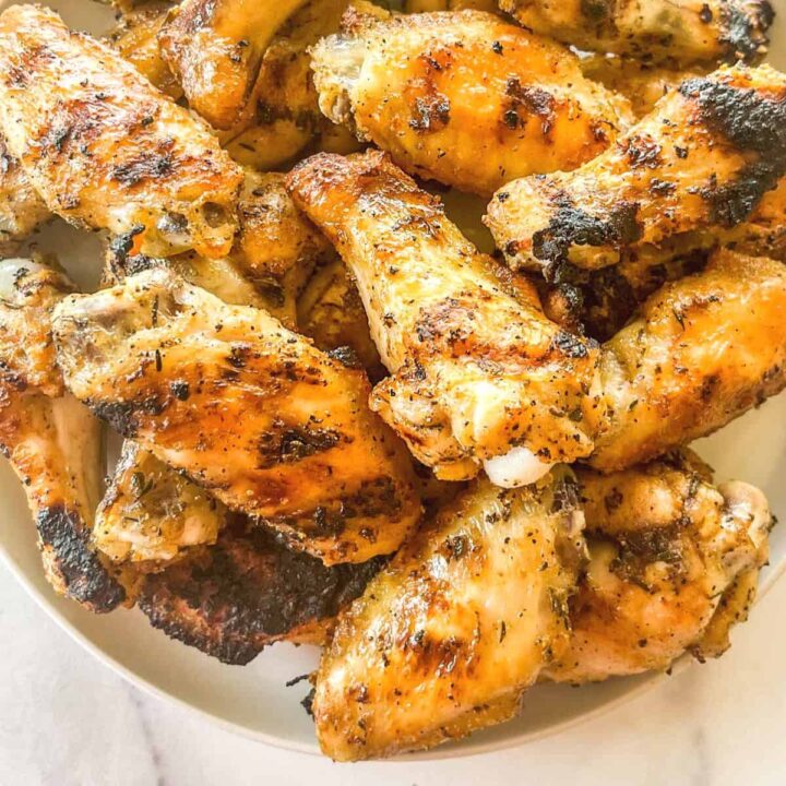 Grilled chicken wings on a plate.