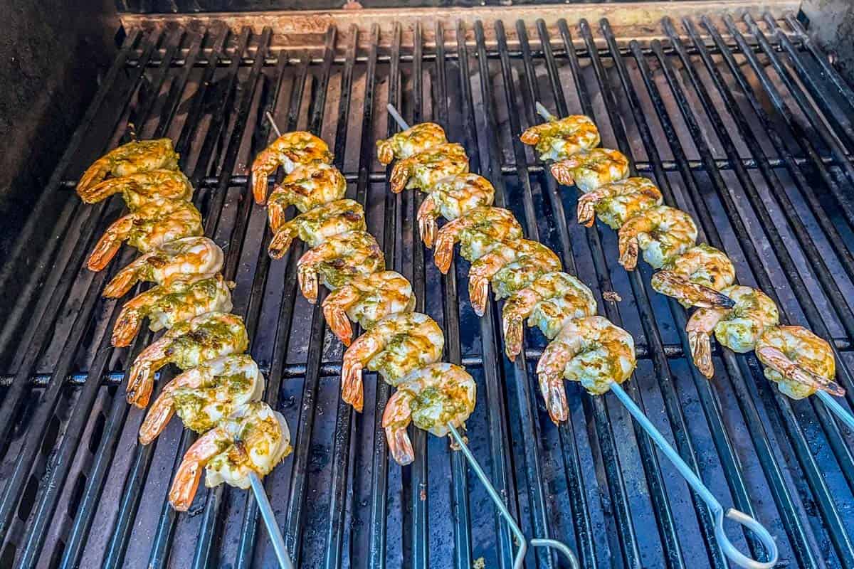 Shrimp skewers on a grill.